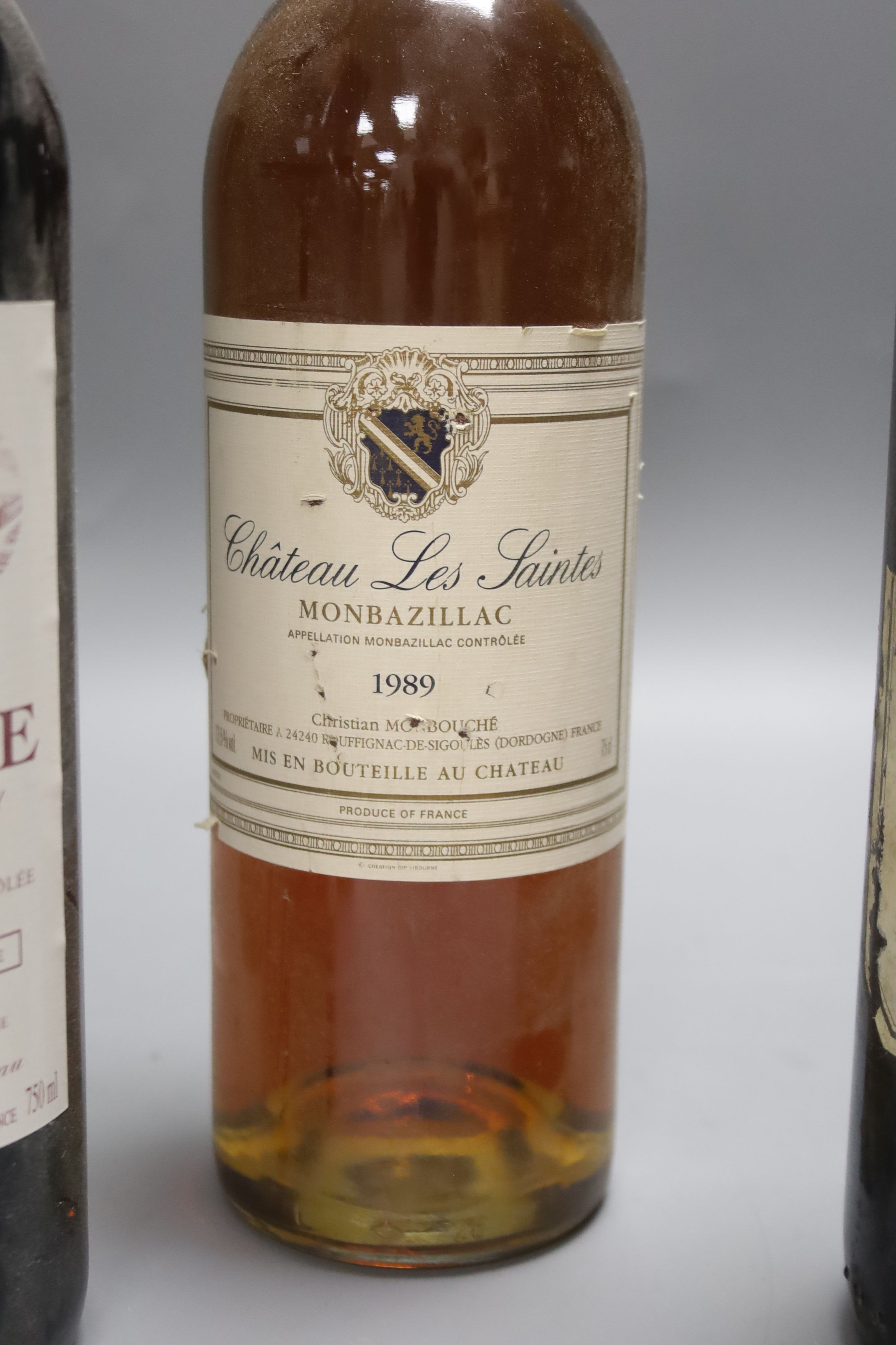Five red Bordeaux wines including two Chateau Beau Site, Saint Estephe, 2001, one Chateau de Saint Puy, 1982, one Ludon Pomies Agassac, 1995, one Giscours, 1959 and one Les Saintes, Monbazillac, 1989.